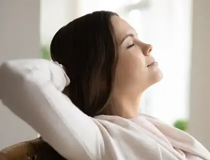 Woman relaxing in clean air after Shamy provided air quality service